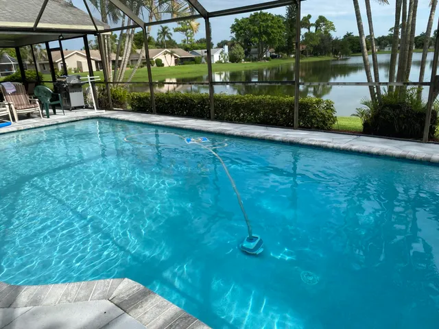 a view of a patio with a table chairs and a table in the patio