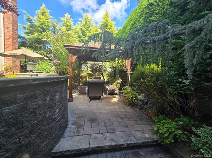 a backyard of a house with outdoor seating