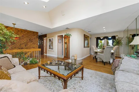a living room with furniture and a rug