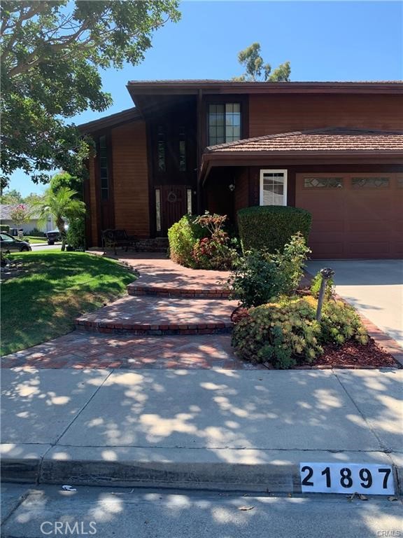 21897 Shenandoah Drive Lake Forest, CA 92630 - Photo 2 of 12 a front view of a house with a yard