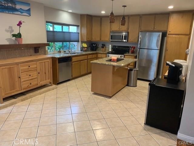 21897 Shenandoah Drive Lake Forest, CA 92630 - Photo 3 of 12 a kitchen with stainless steel appliances a refrigerator sink and microwave