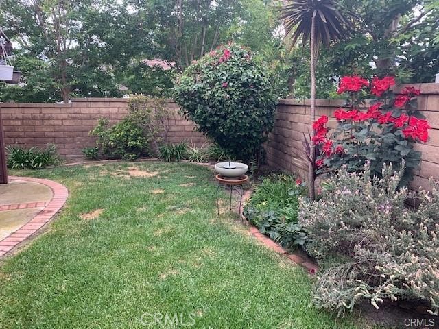 21897 Shenandoah Drive Lake Forest, CA 92630 - Photo 9 of 12 a view of a backyard with plants and a fountain