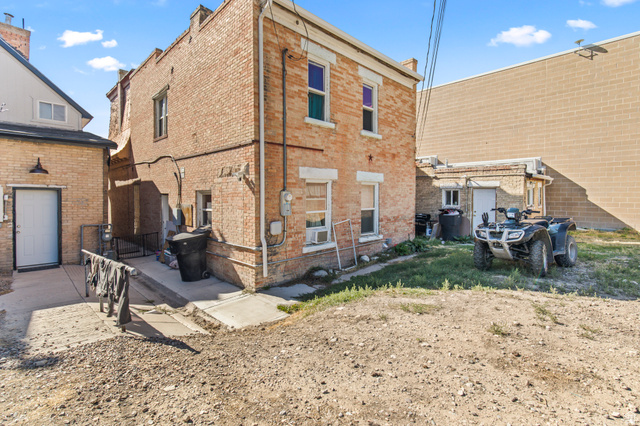 69 South Main Street Manti, UT 84642 - Photo 13 of 44 Two-story brick exterior with white trim accents and multiple window openings