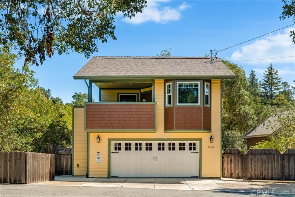a view of a house with a tree