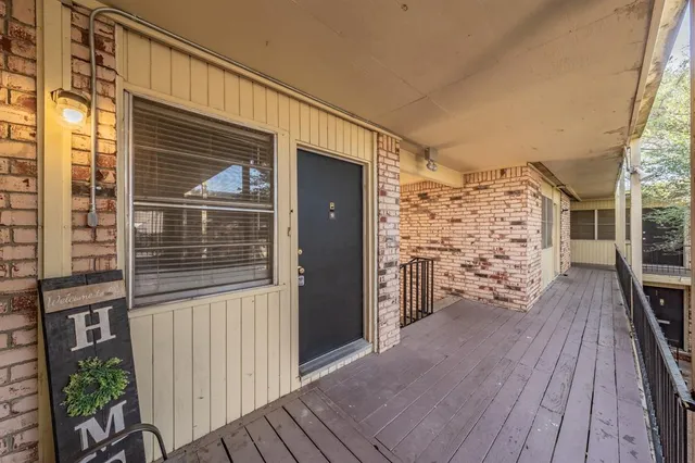 a view of gallery with wooden floor