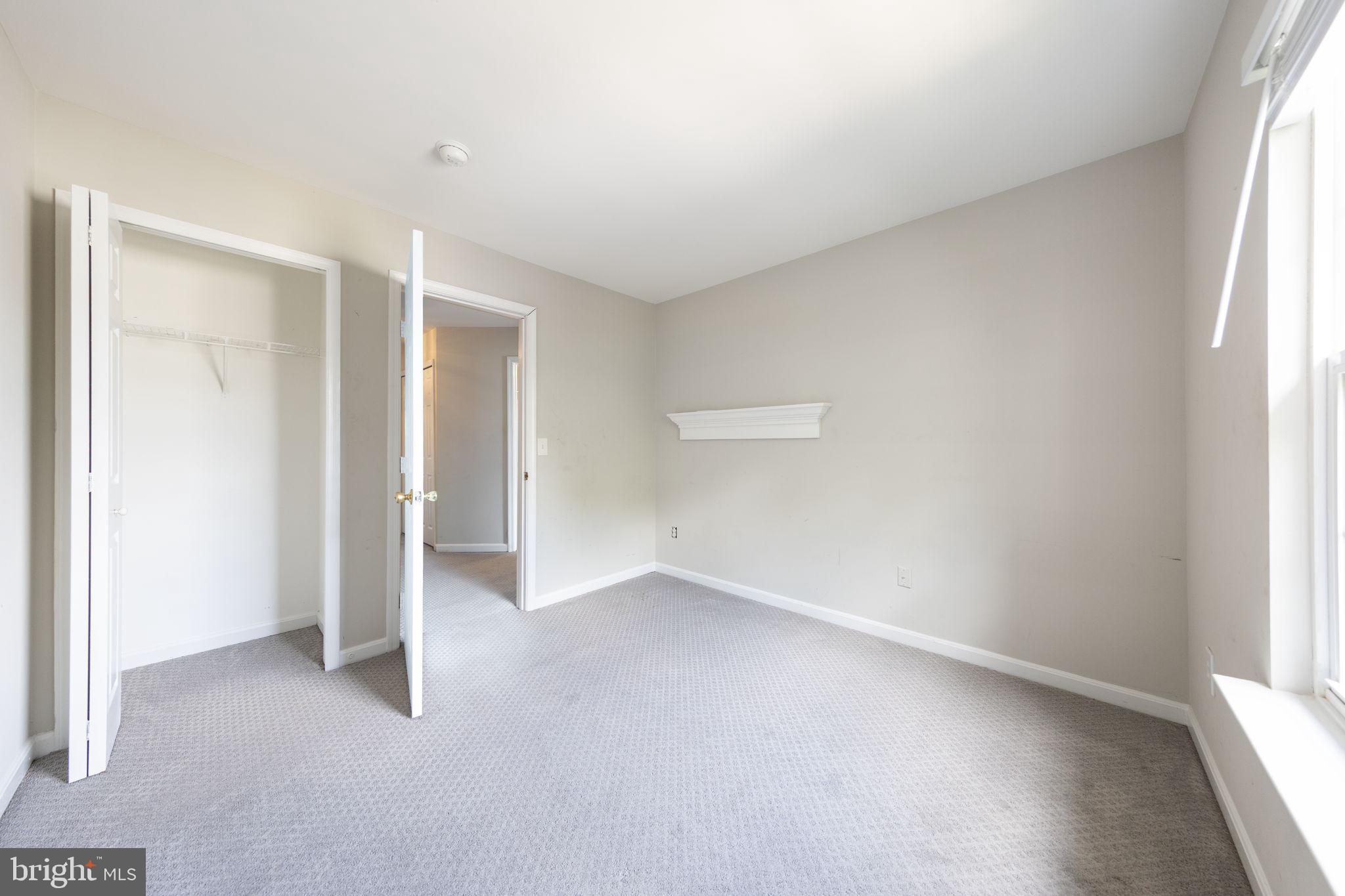 43115 Candlewick Square Leesburg, VA 20176 - Photo 20 of 31 an empty room with a empty space and windows