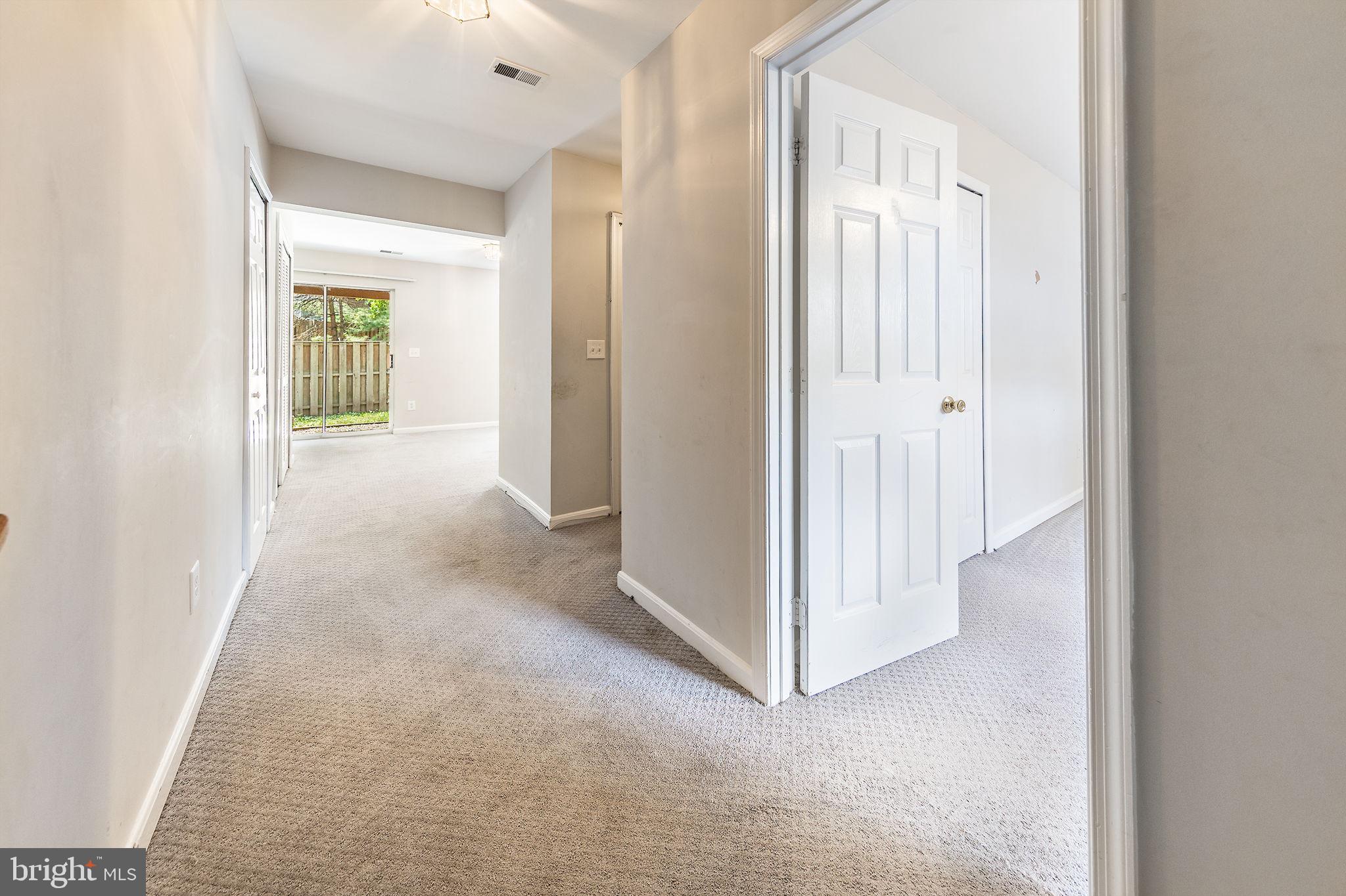 43115 Candlewick Square Leesburg, VA 20176 - Photo 23 of 31 a view of a hallway with wooden floor
