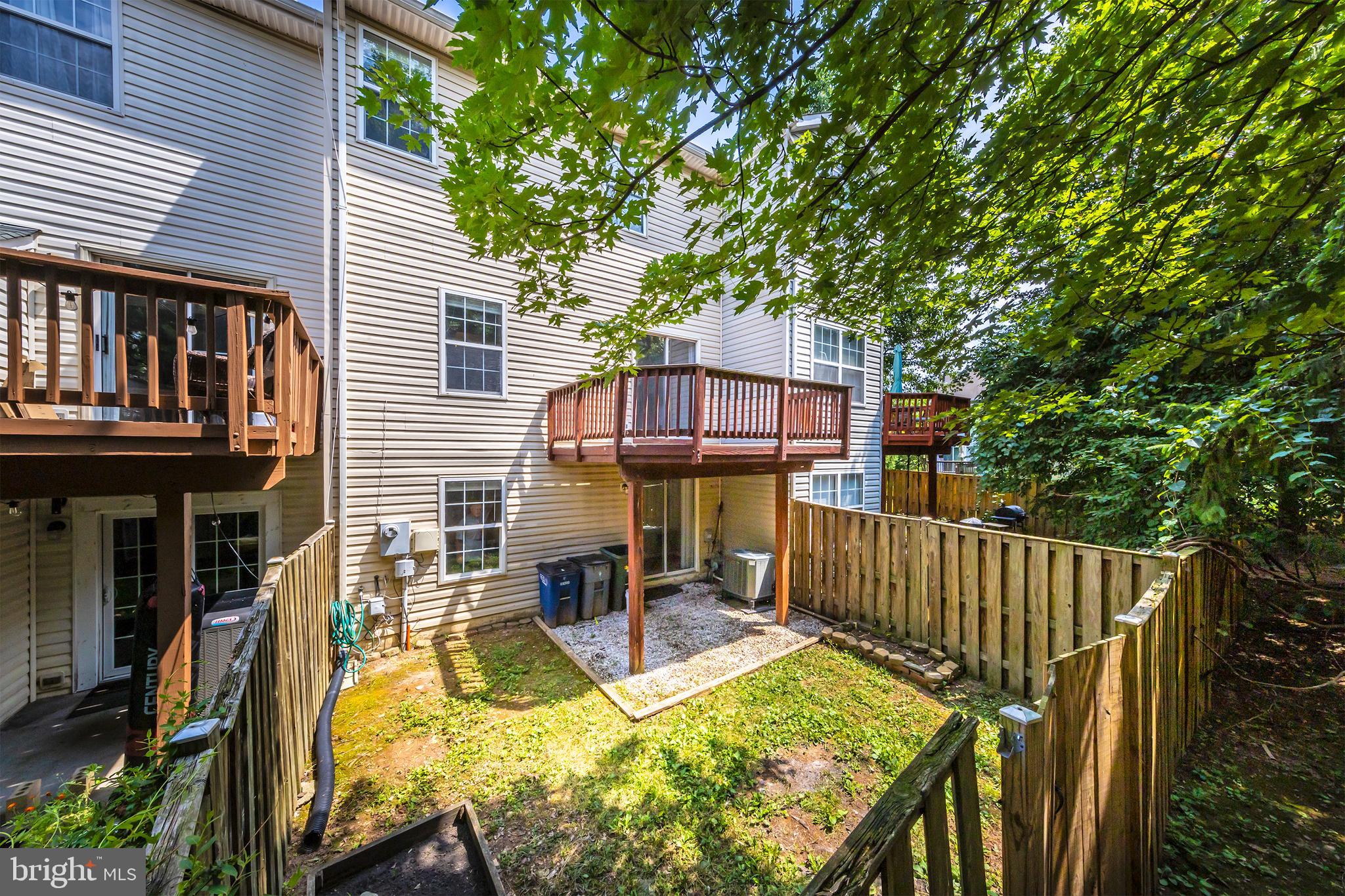43115 Candlewick Square Leesburg, VA 20176 - Photo 3 of 31 a view of a patio with a table chairs and a barbeque