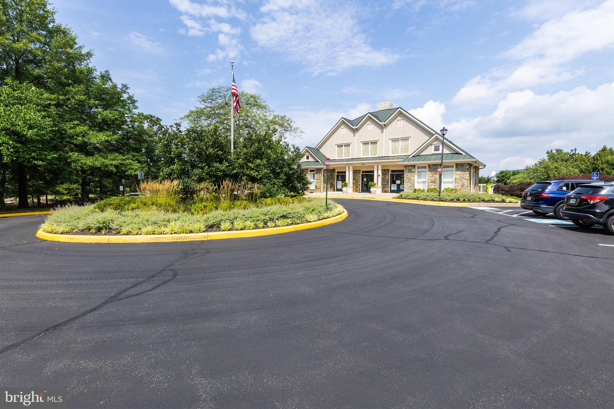 43115 Candlewick Square Leesburg, VA 20176 - Photo 31 of 31 a front view of a house with a yard and garage