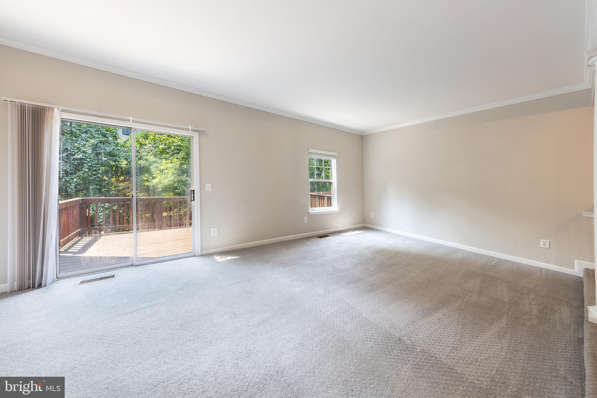 43115 Candlewick Square Leesburg, VA 20176 - Photo 10 of 31 a view of a big room with windows and chandelier fan
