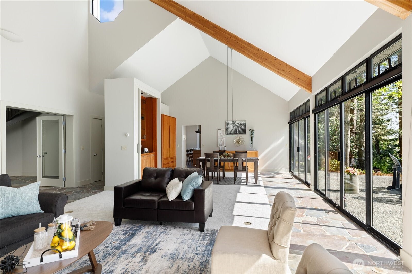 1912 East Hunskor Road Oak Harbor, WA 98277 - Photo 11 of 40 a living room with furniture and a floor to ceiling window