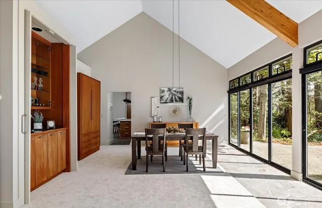 a view of a dining room with furniture window and outside view