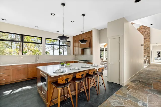 a kitchen with stainless steel appliances granite countertop a stove and refrigerator