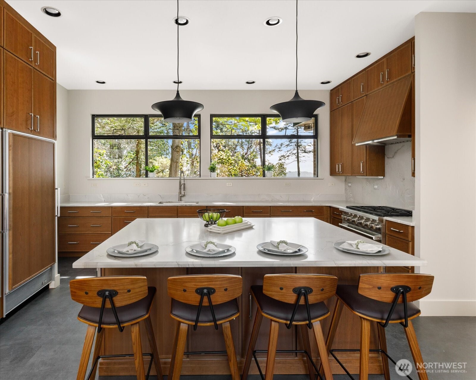 1912 East Hunskor Road Oak Harbor, WA 98277 - Photo 16 of 40 a kitchen with a table chairs sink and wooden floor