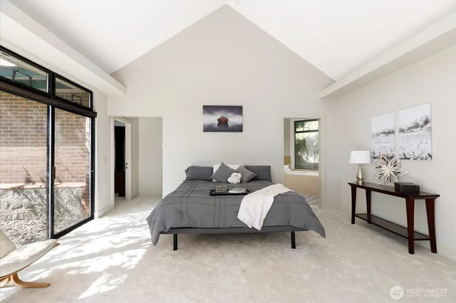 a bedroom with bed and window