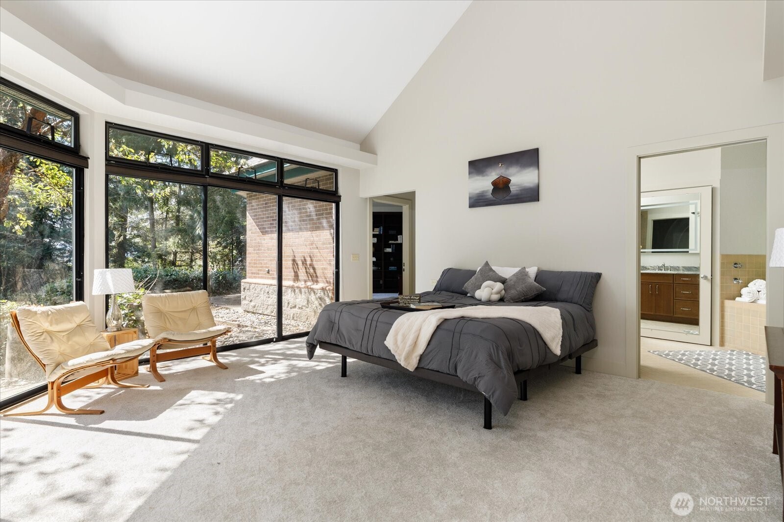 1912 East Hunskor Road Oak Harbor, WA 98277 - Photo 23 of 40 a spacious bedroom with a bed and large window