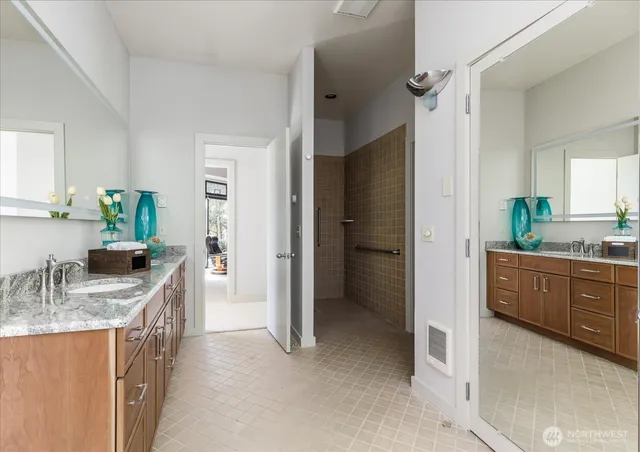 a kitchen with granite countertop a refrigerator and a sink