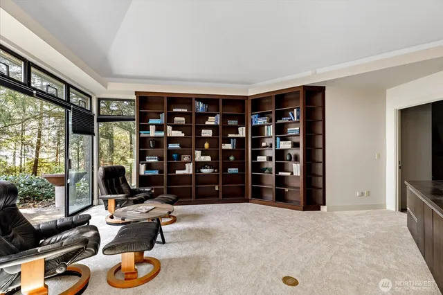 a living room with furniture a window and flat screen tv
