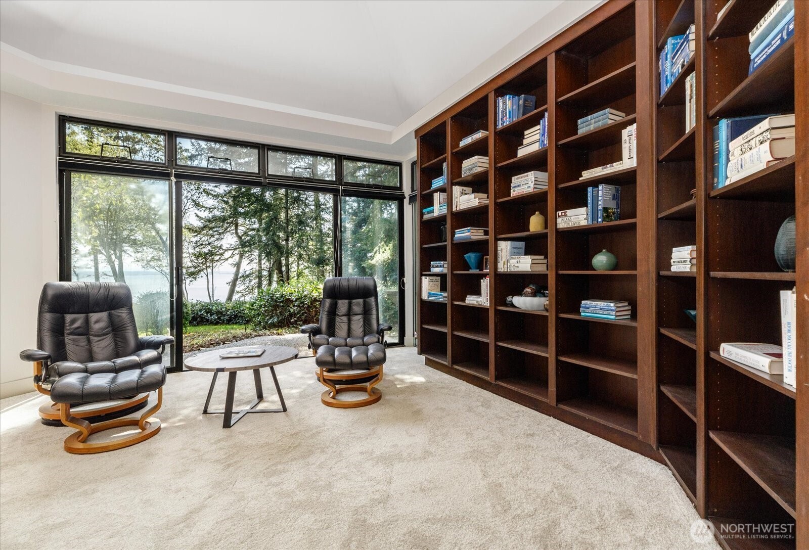 1912 East Hunskor Road Oak Harbor, WA 98277 - Photo 27 of 40 a room with furniture and a floor to ceiling window