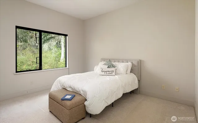 a bedroom with a bed and window