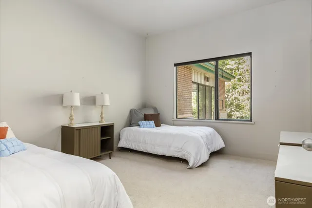 a bedroom with a bed and window