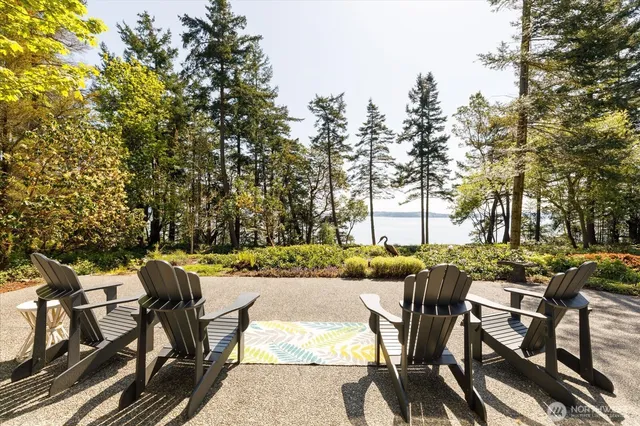 a view of a chairs and table on the patio