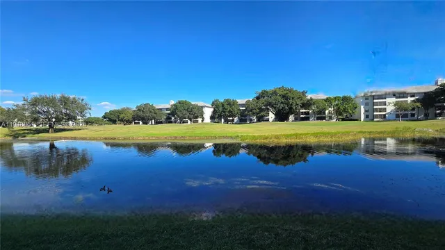 a view of a lake with houses in the background