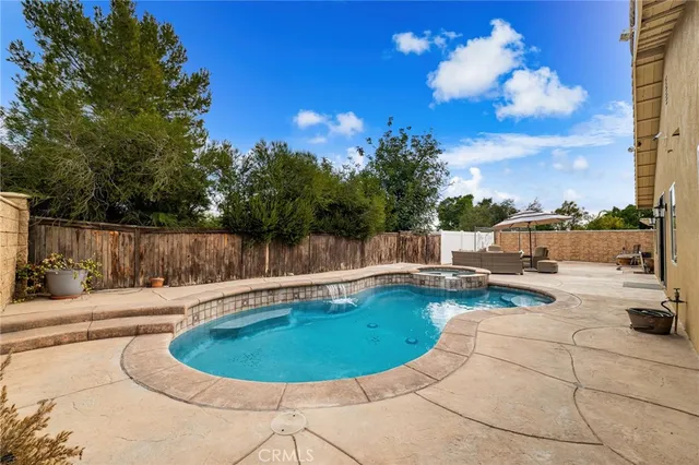 a view of a swimming pool with a sitting space
