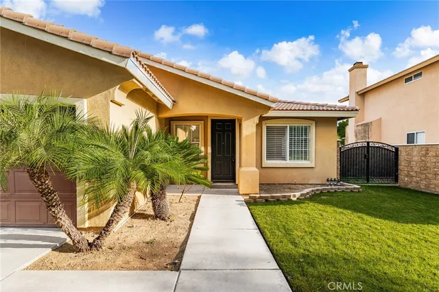 a front view of a house with yard