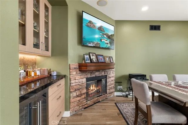 a dining room with furniture and fireplace
