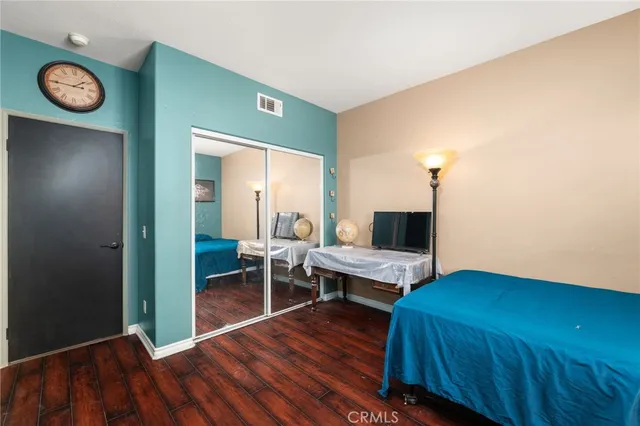 a bedroom with a bed and a table in it