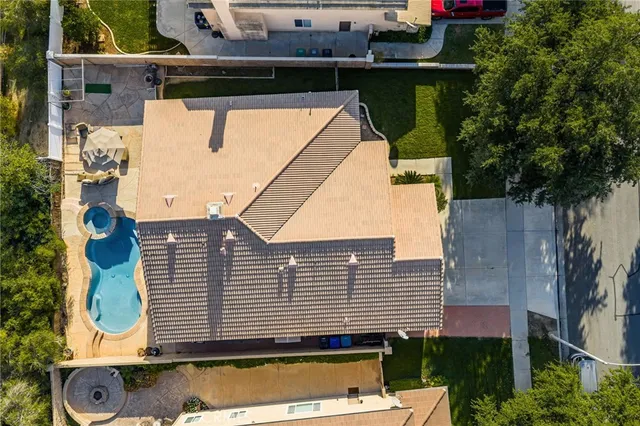 an aerial view of a house with swimming pool