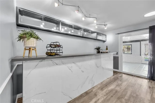 a view of a kitchen with a dishwasher and a refrigerator