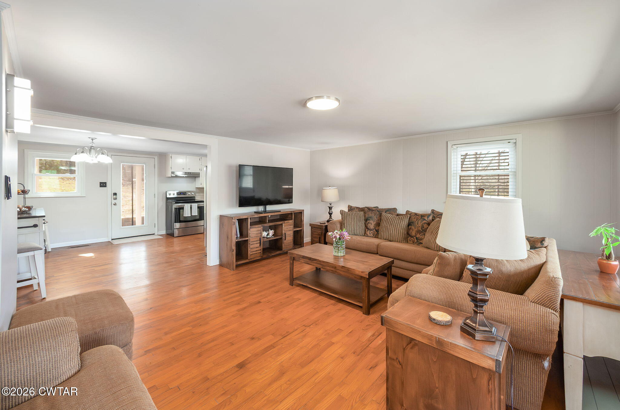 108 Springbrook Drive Jackson, TN 38305 - Photo 11 of 40 a living room with furniture and a flat screen tv