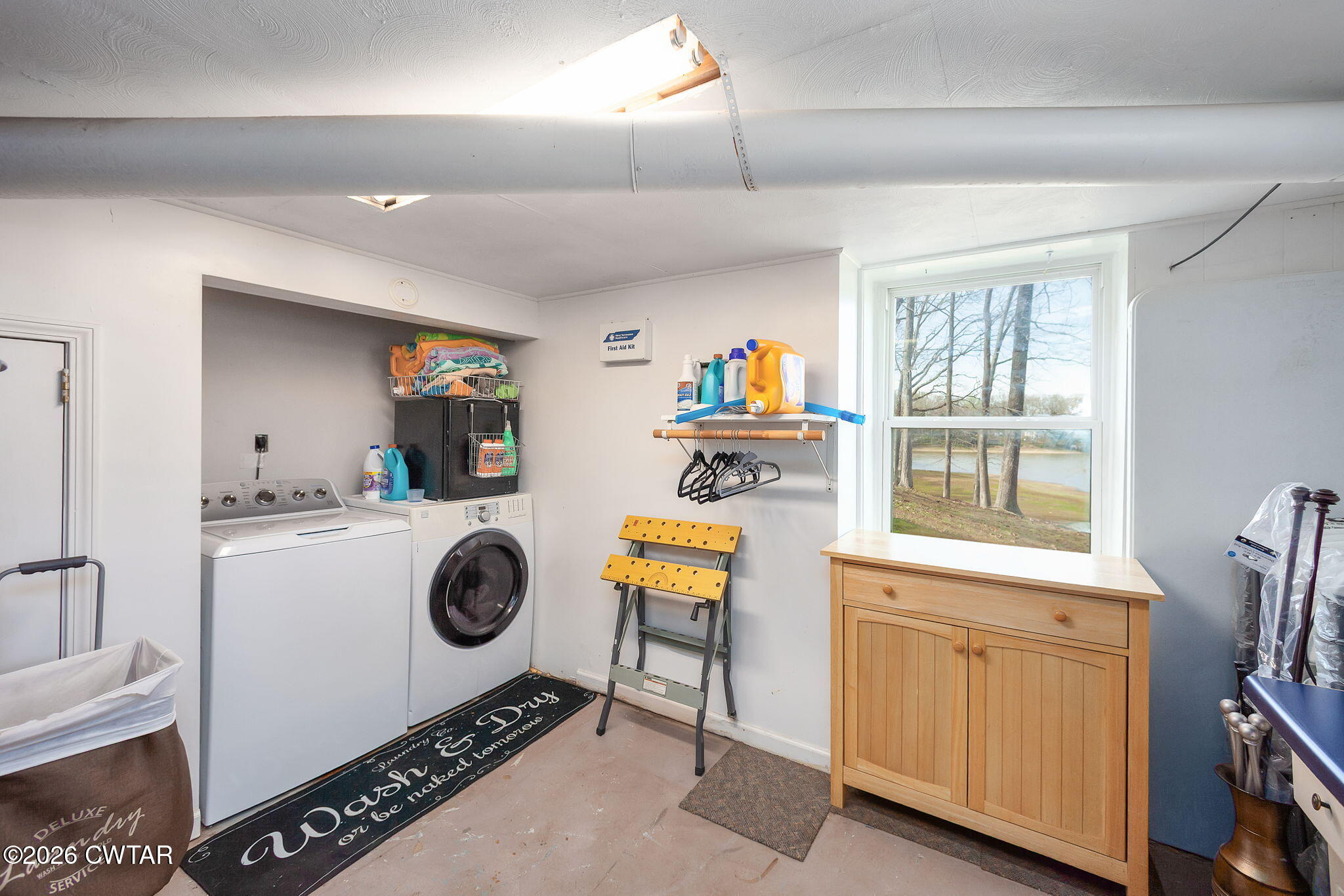 108 Springbrook Drive Jackson, TN 38305 - Photo 13 of 40 a utility room with sink dryer and washer