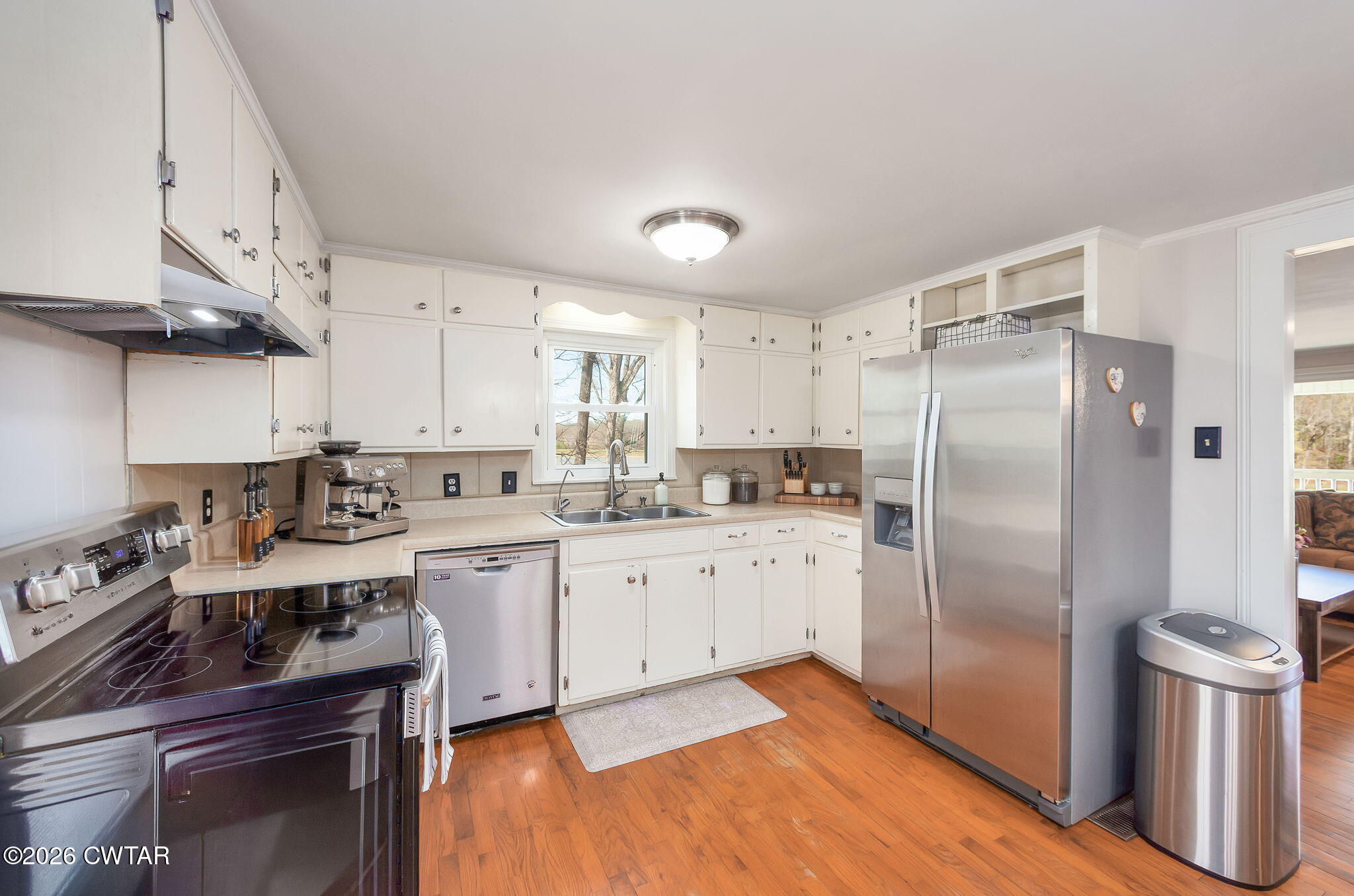 108 Springbrook Drive Jackson, TN 38305 - Photo 14 of 40 a kitchen with stainless steel appliances granite countertop a sink stove and refrigerator