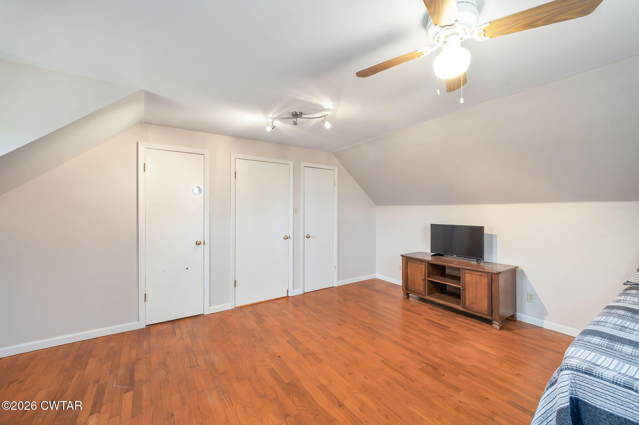 108 Springbrook Drive Jackson, TN 38305 - Photo 17 of 40 a bedroom with a bed and a chandelier