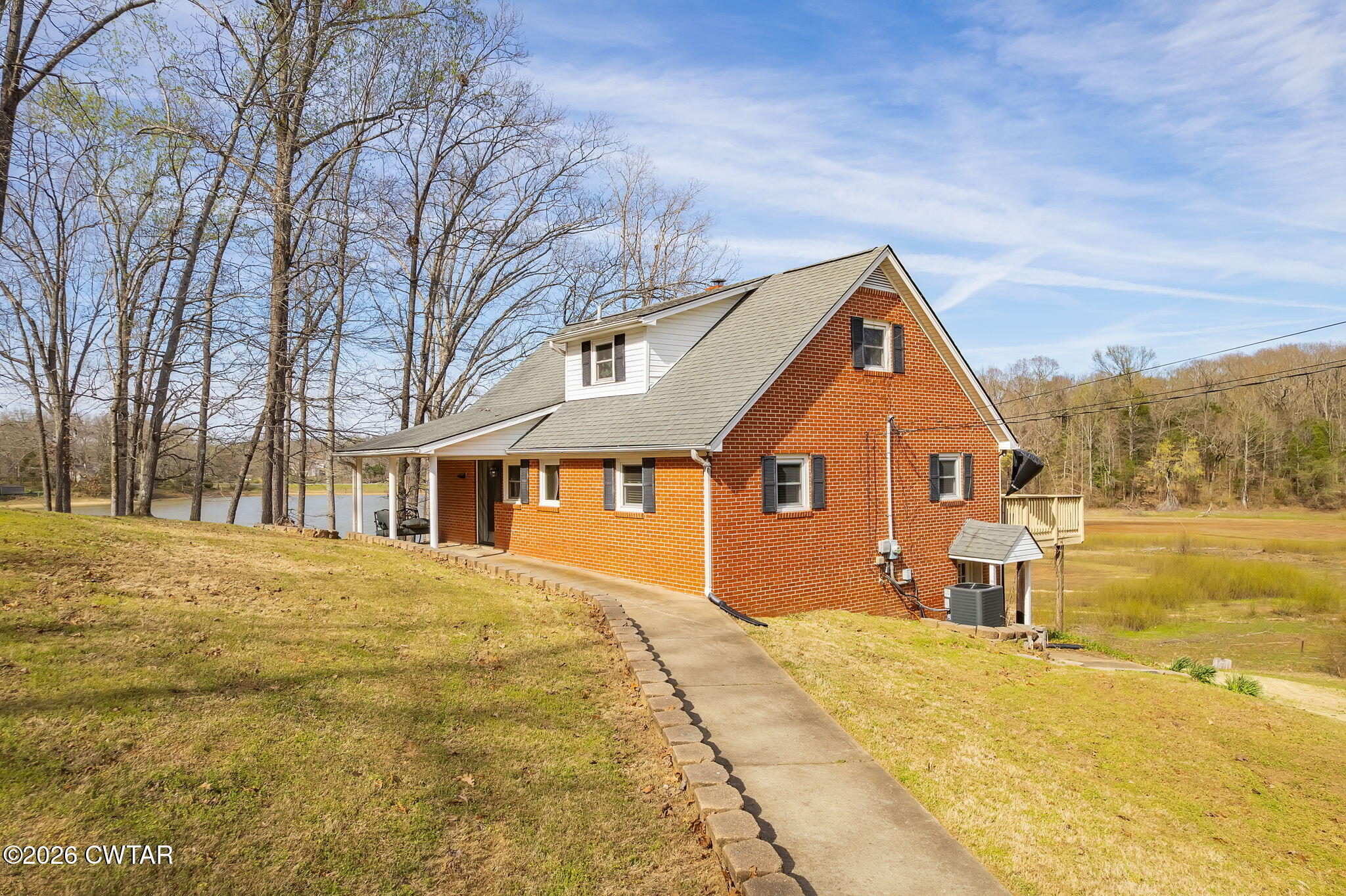 108 Springbrook Drive Jackson, TN 38305 - Photo 20 of 40 a front view of a house with a yard