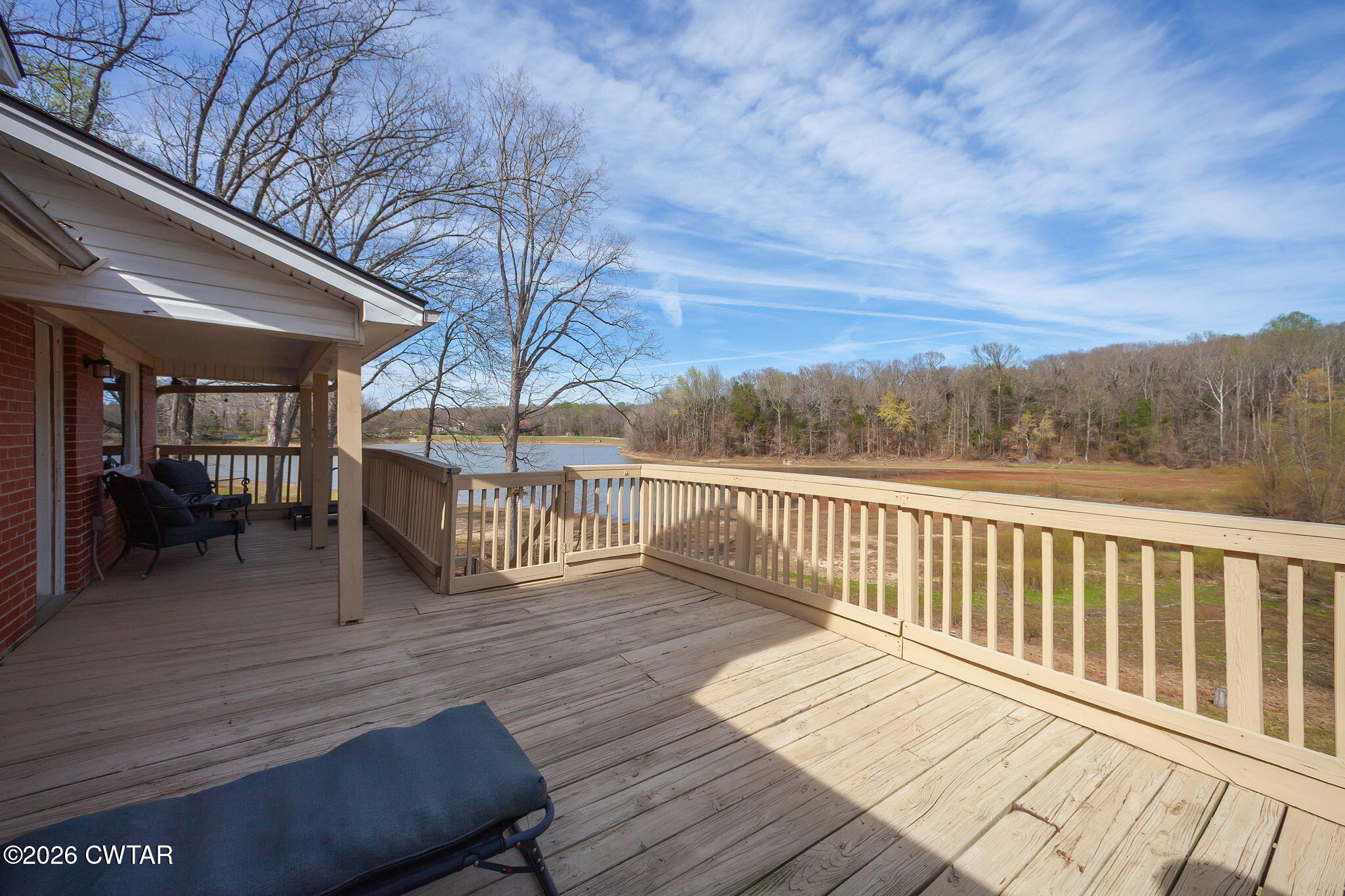108 Springbrook Drive Jackson, TN 38305 - Photo 2 of 40 a view of a balcony with wooden floor and fence
