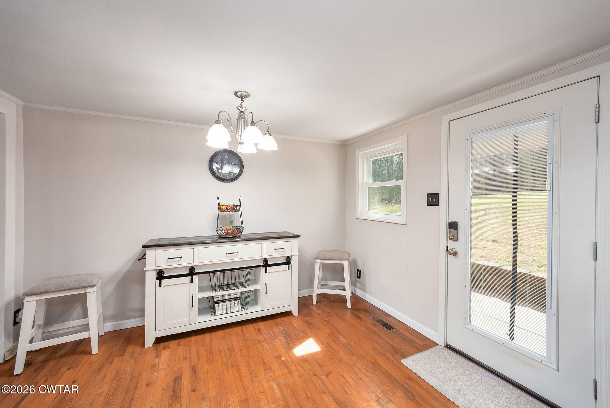 108 Springbrook Drive Jackson, TN 38305 - Photo 27 of 40 a view of a room with wooden floor and white walls
