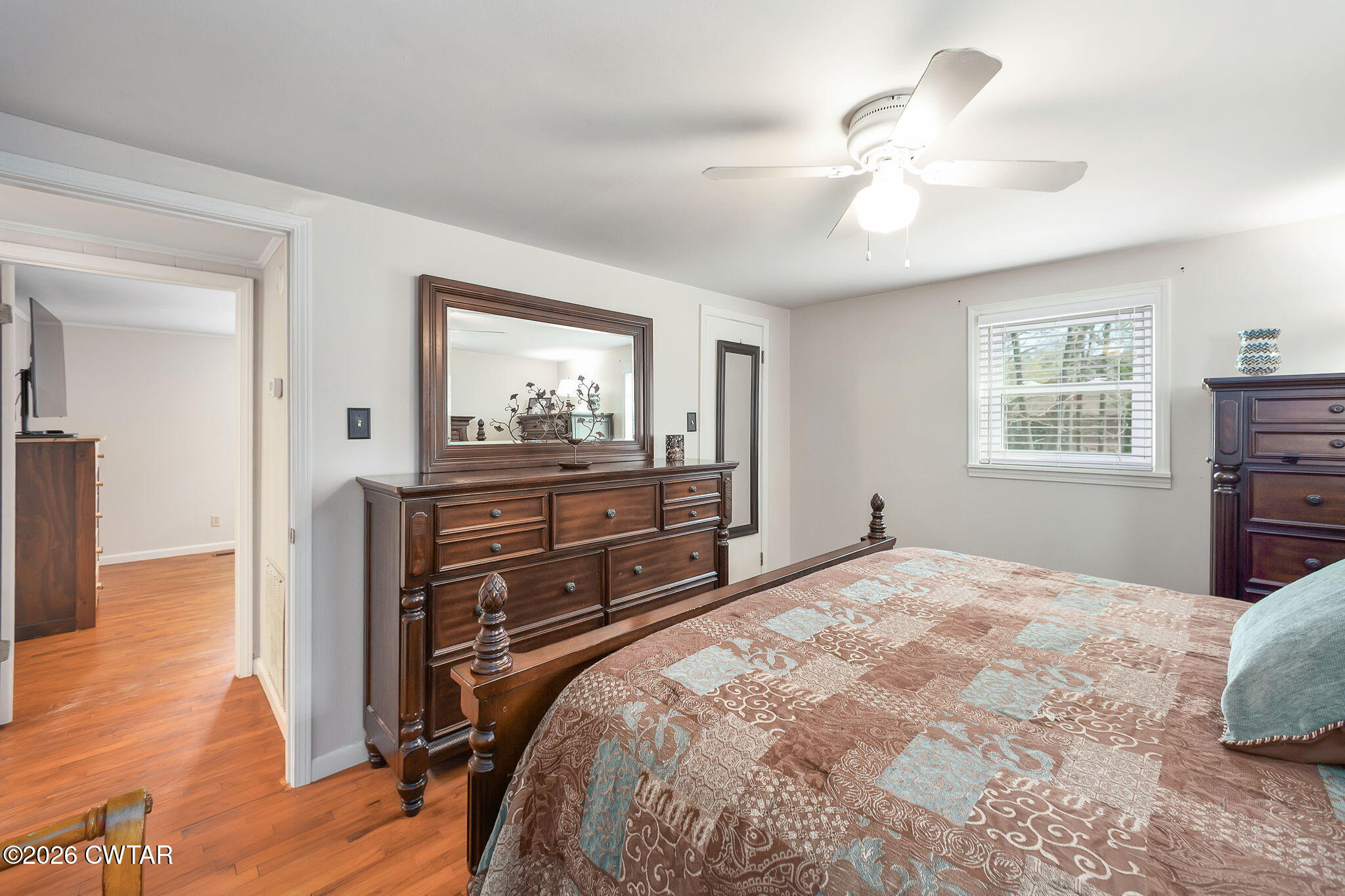 108 Springbrook Drive Jackson, TN 38305 - Photo 30 of 40 a bedroom with a bed and wooden floor