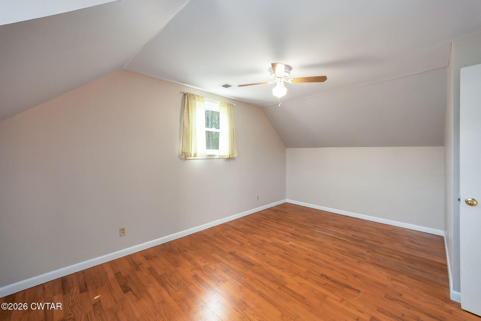 108 Springbrook Drive Jackson, TN 38305 - Photo 31 of 40 wooden floor in an empty room with a window