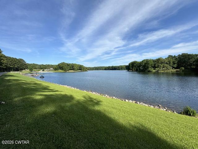 108 Springbrook Drive Jackson, TN 38305 - Photo 34 of 40 a view of a lake with houses in the back