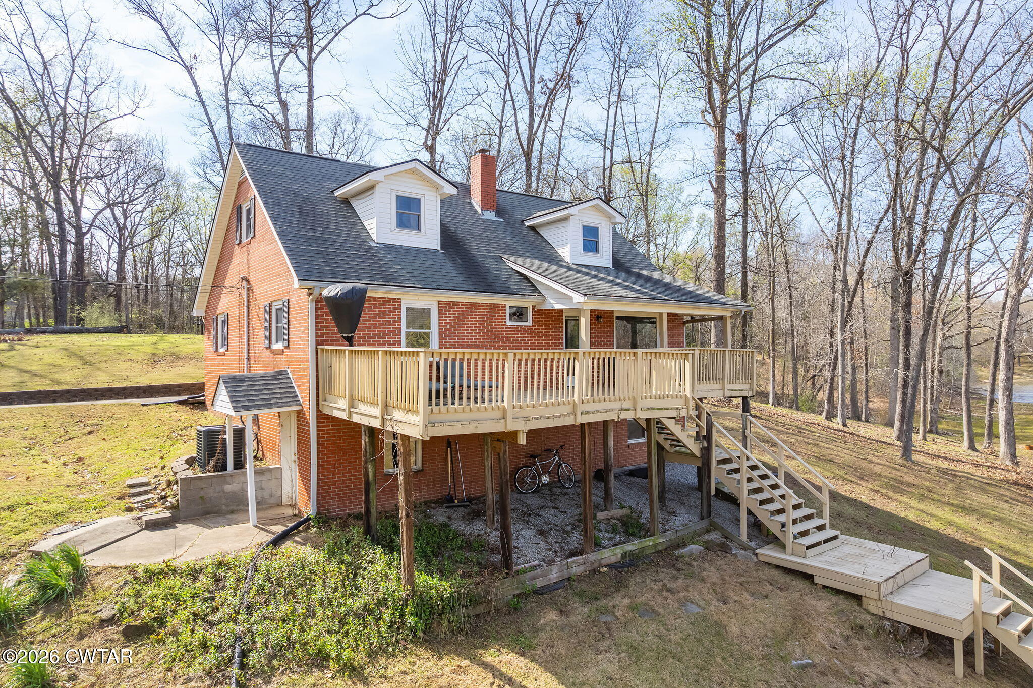 108 Springbrook Drive Jackson, TN 38305 - Photo 35 of 40 a front view of a house with a garden