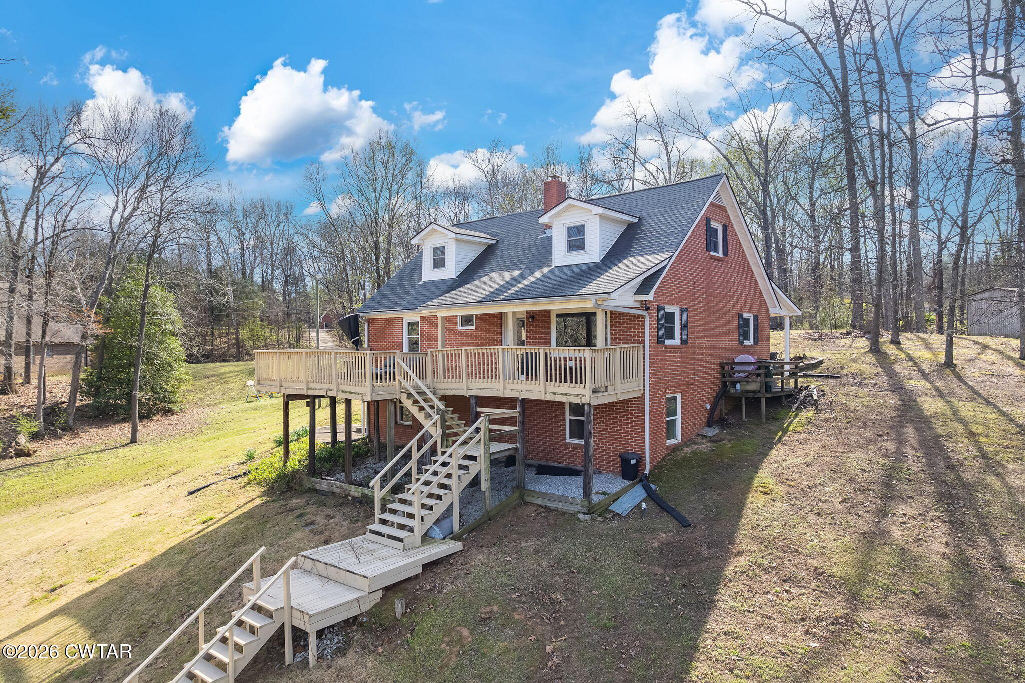 108 Springbrook Drive Jackson, TN 38305 - Photo 37 of 40 a view of a house with backyard and sitting area