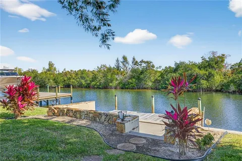 a view of a lake with a garden and a lake view