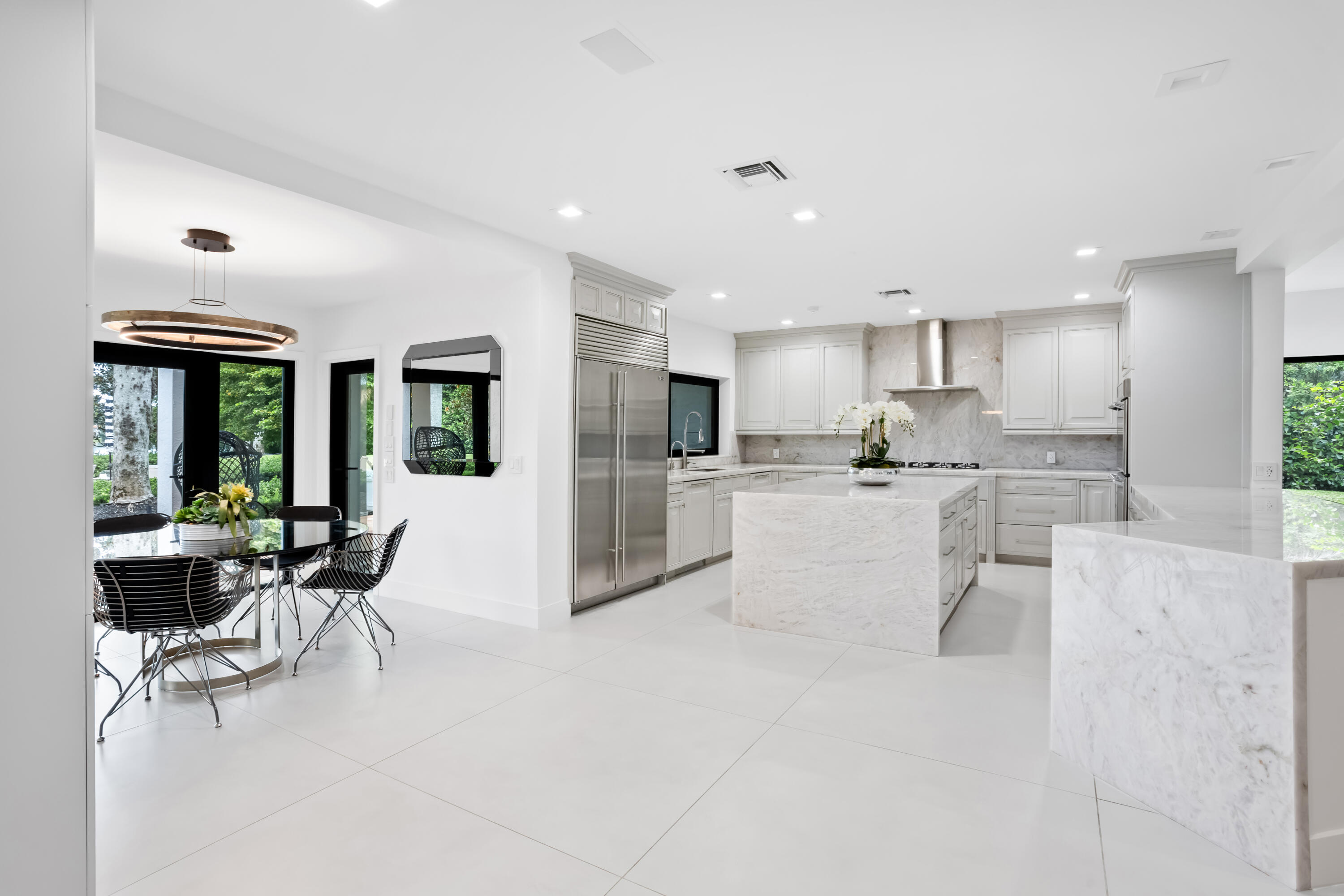 18743 Long Lake Drive Boca Raton, FL 33496 - Photo 17 of 84 a living room with stainless steel appliances kitchen island granite countertop furniture and a view of kitchen