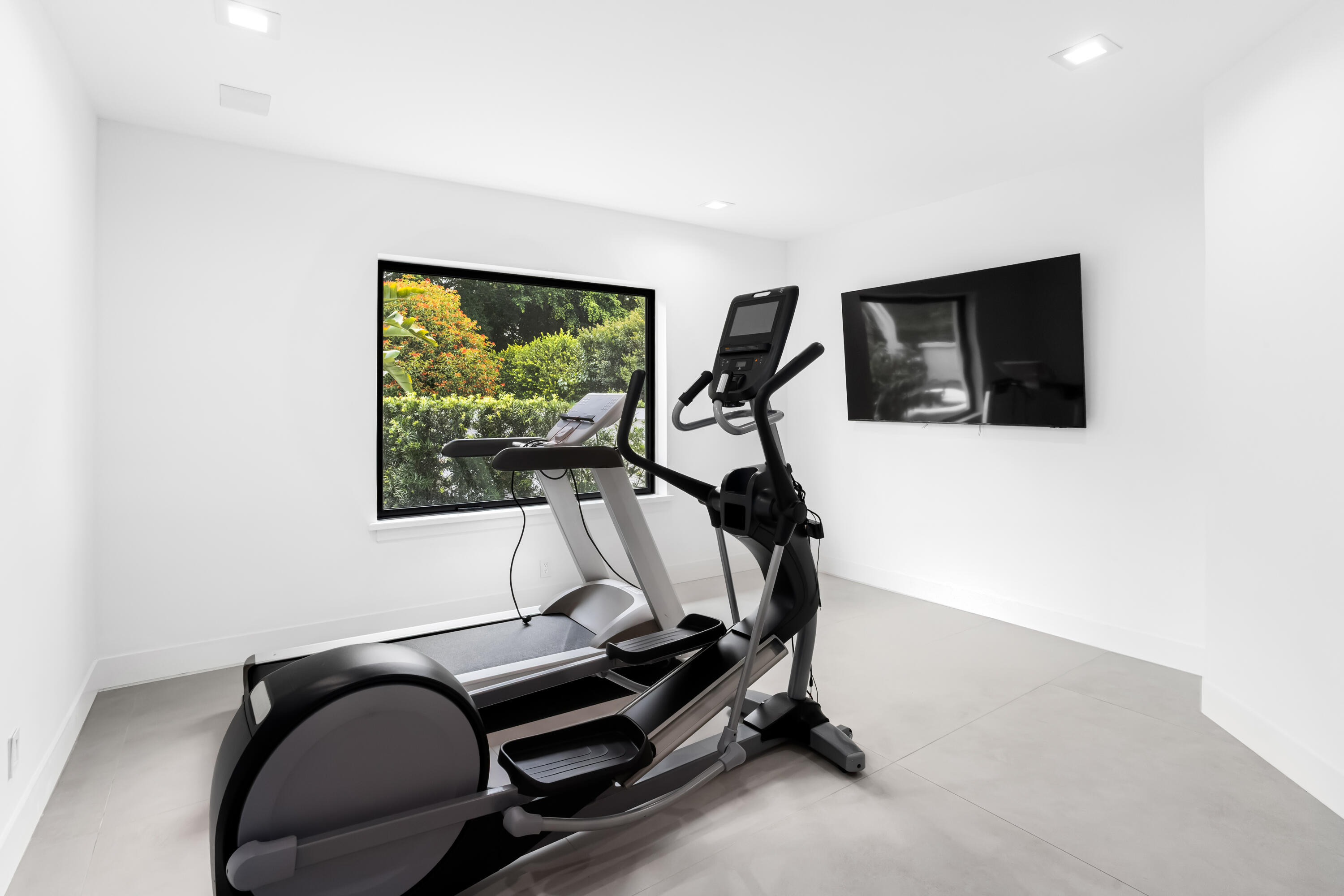 18743 Long Lake Drive Boca Raton, FL 33496 - Photo 31 of 84 a room with gym equipment and a flat screen tv