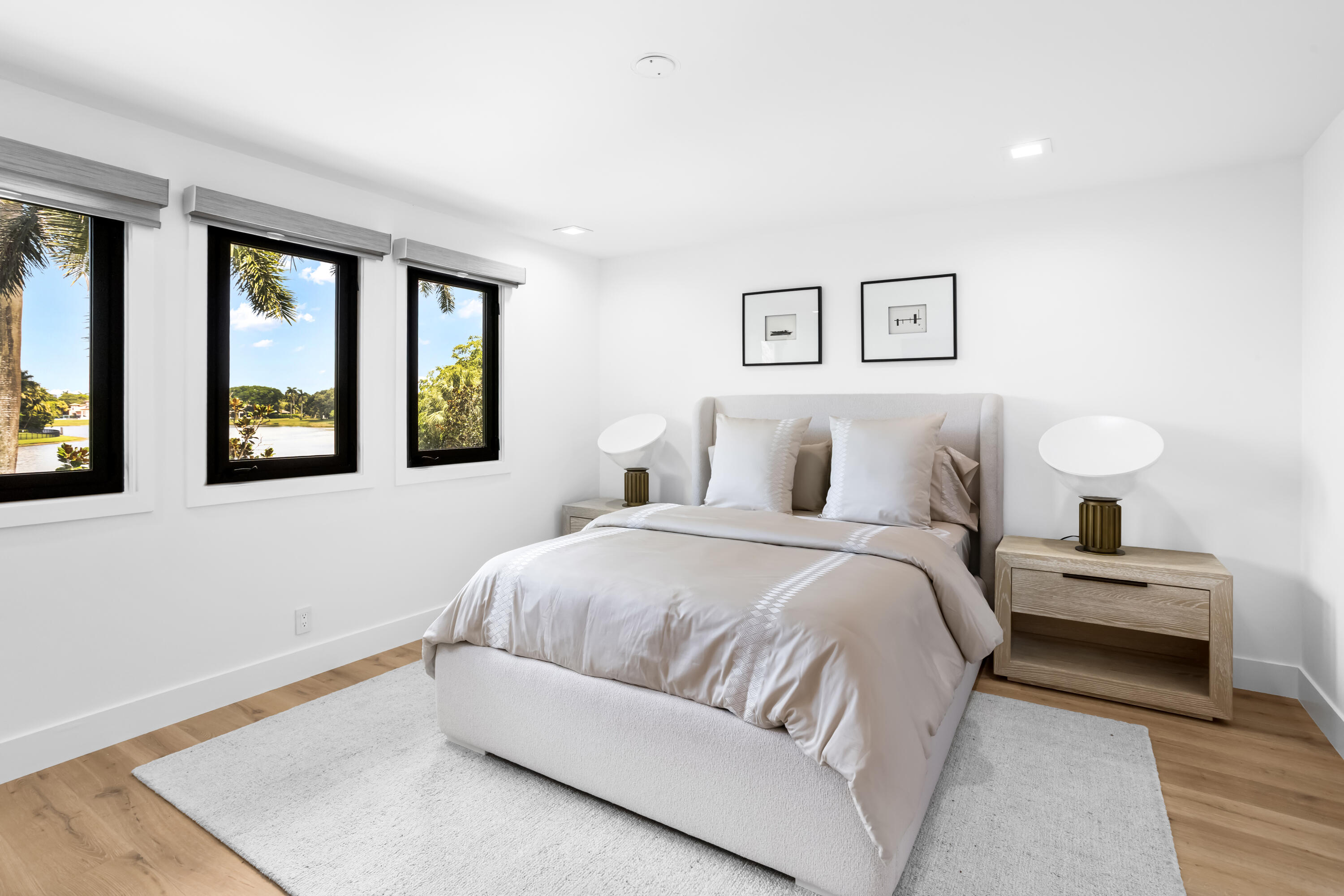 18743 Long Lake Drive Boca Raton, FL 33496 - Photo 34 of 84 a bedroom with a large bed and a night stand