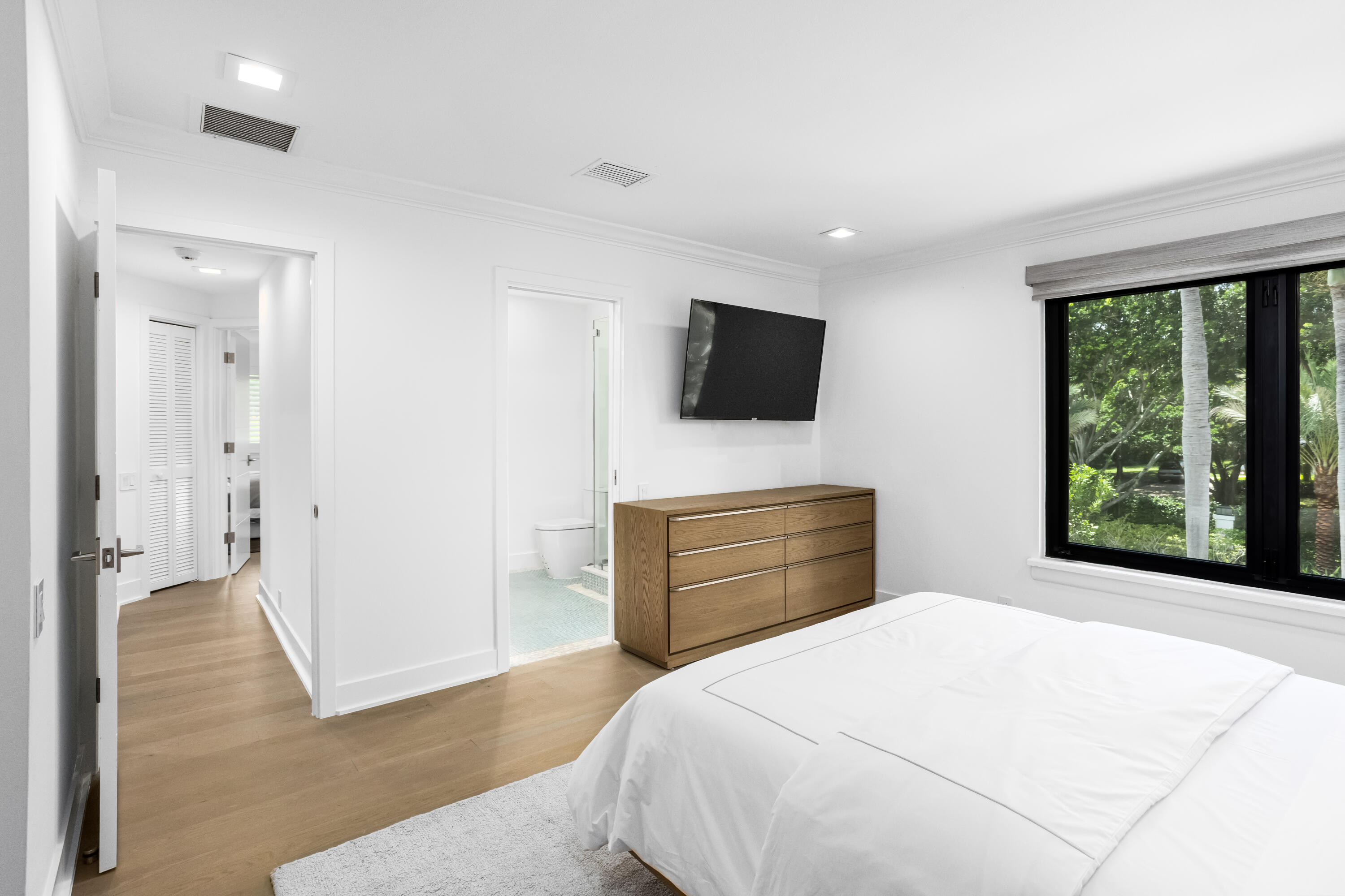 18743 Long Lake Drive Boca Raton, FL 33496 - Photo 52 of 84 a bedroom with a bed and a flat screen tv